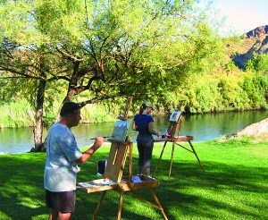 Photograph of two art students taking Kevin McCain plein air painting workshops